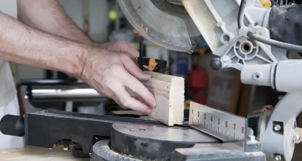 What is the difference between a standard miter saw and a compound miter saw?