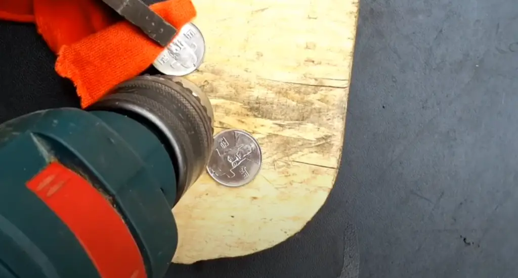 Clamp the coin securely to your work surface