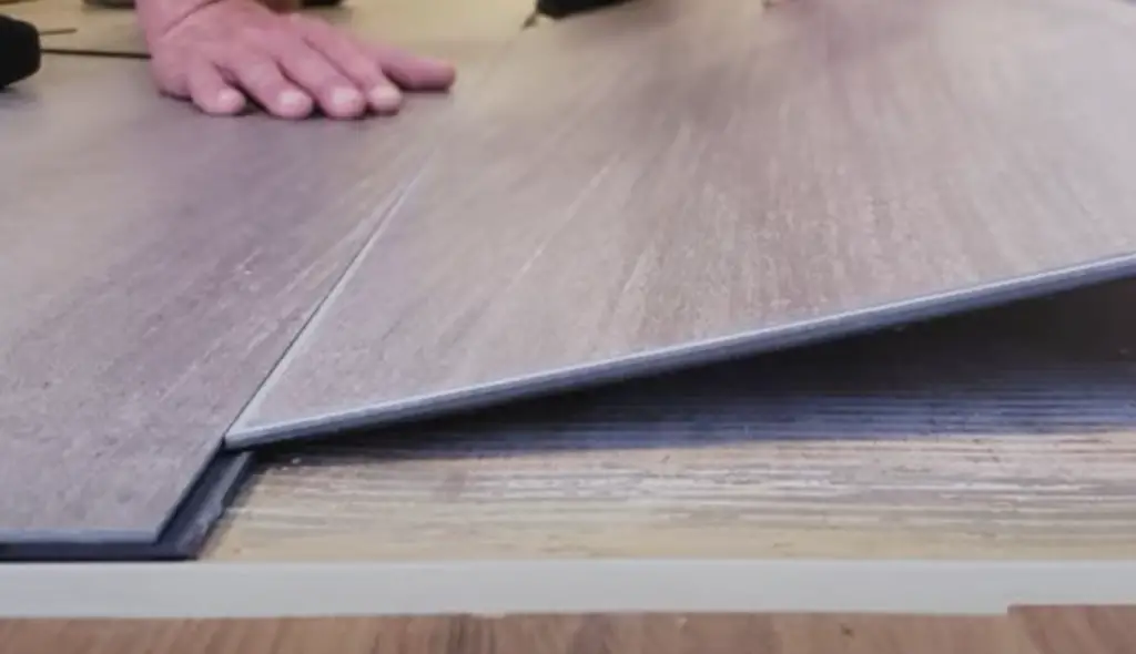 Do you cut laminate flooring face up or down?